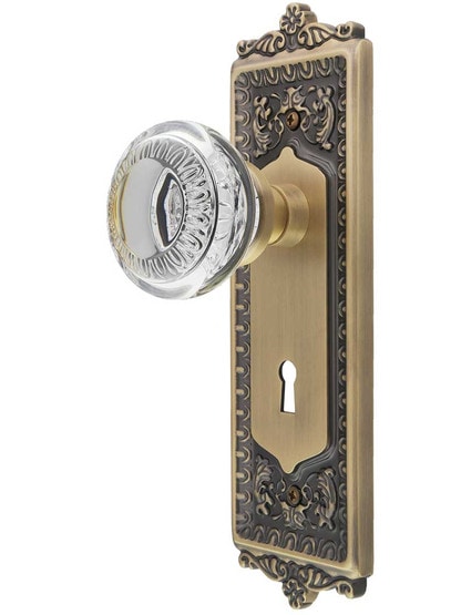 Egg and Dart Design Mortise-Lock Set with Ovolo Crystal-Glass Knobs in Antique Brass.
